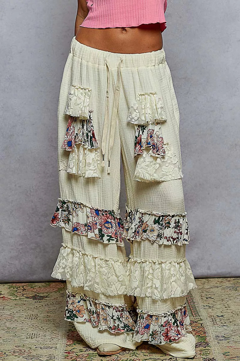 Wide-leg cotton pants with lace and floral tiered ruffles, drawstring waistband, and bohemian style
