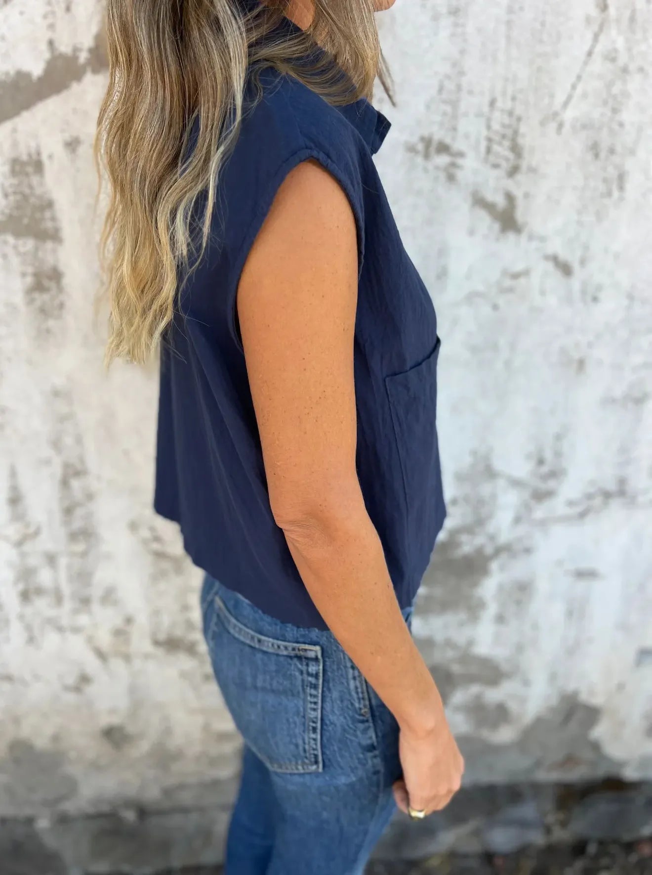 Breezy Linen Cap Sleeve Shirt in blue with button-down front, cap sleeves, and pockets.