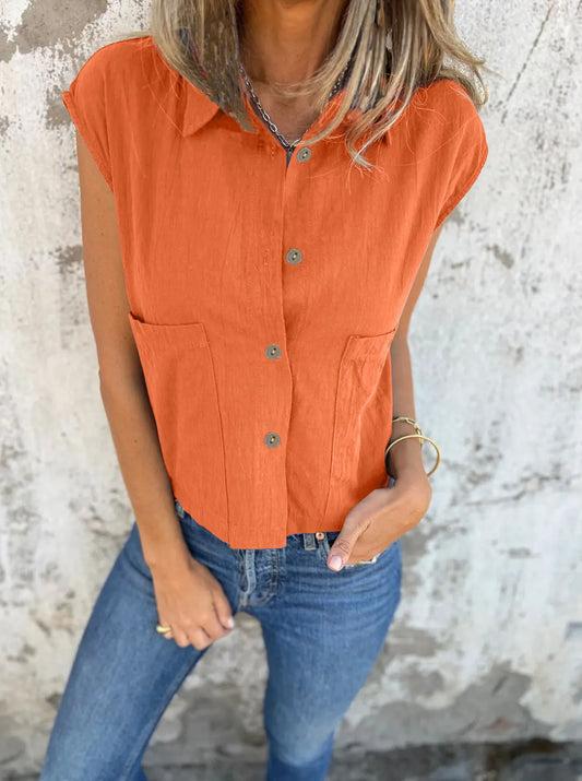 Breezy Linen Cap Sleeve Shirt in orange with button-down front, cap sleeves, and pockets.