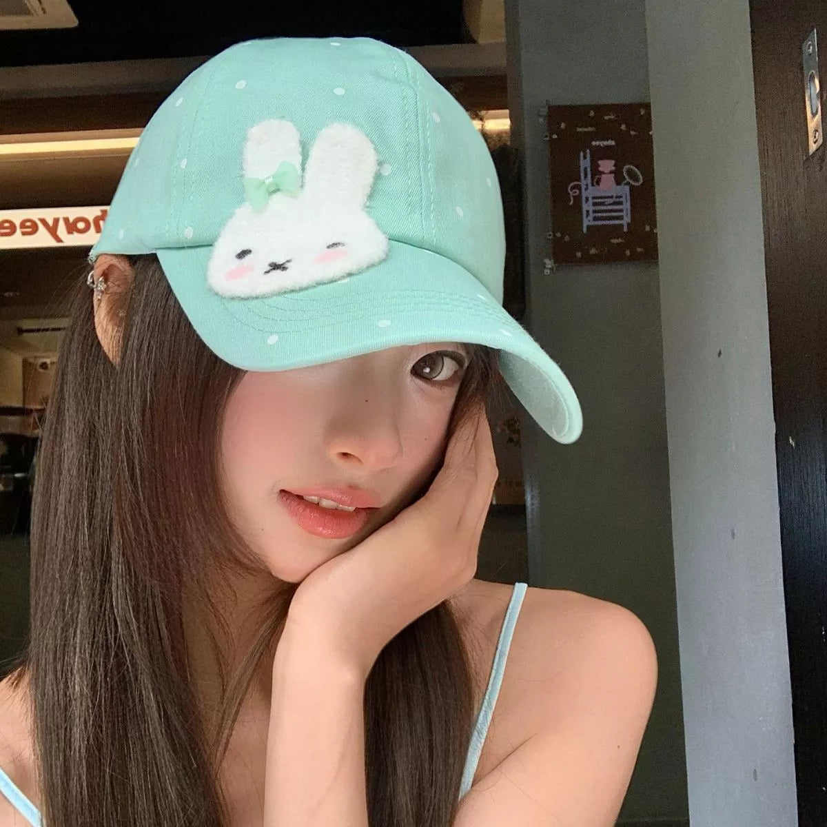 Cotton baseball cap with polka dot print, fuzzy bunny face patch, curved brim, and multiple color options.