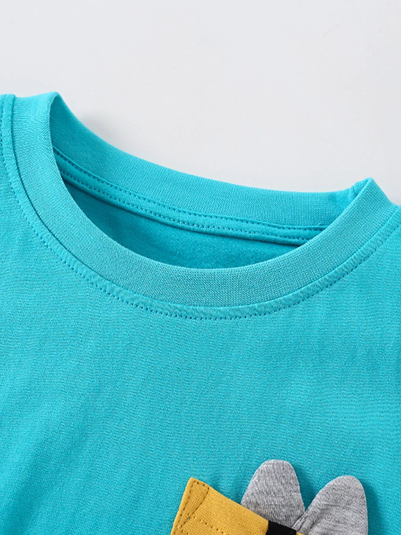 Turquoise kids two piece cotton set with bee pocket t shirt and smiling flower print shorts