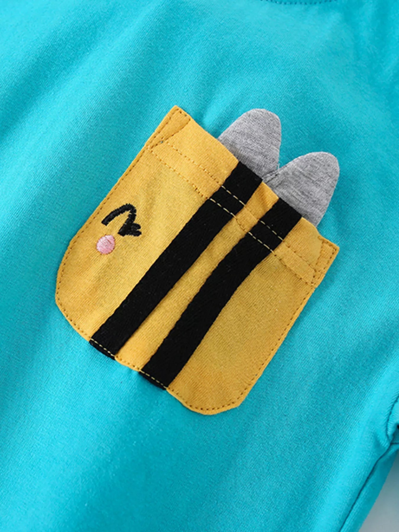 Turquoise kids two piece cotton set with bee pocket t shirt and smiling flower print shorts