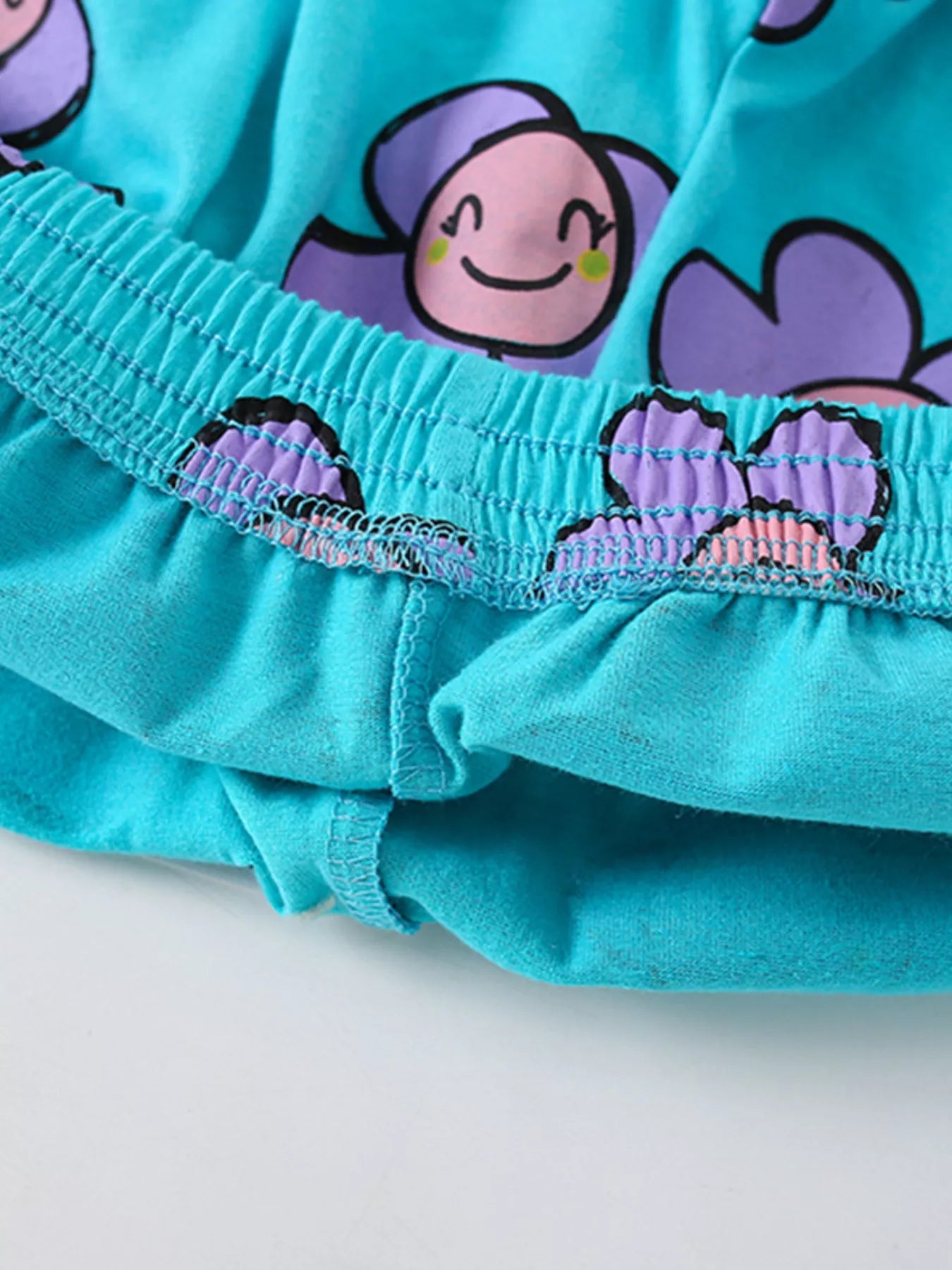 Turquoise kids two piece cotton set with bee pocket t shirt and smiling flower print shorts