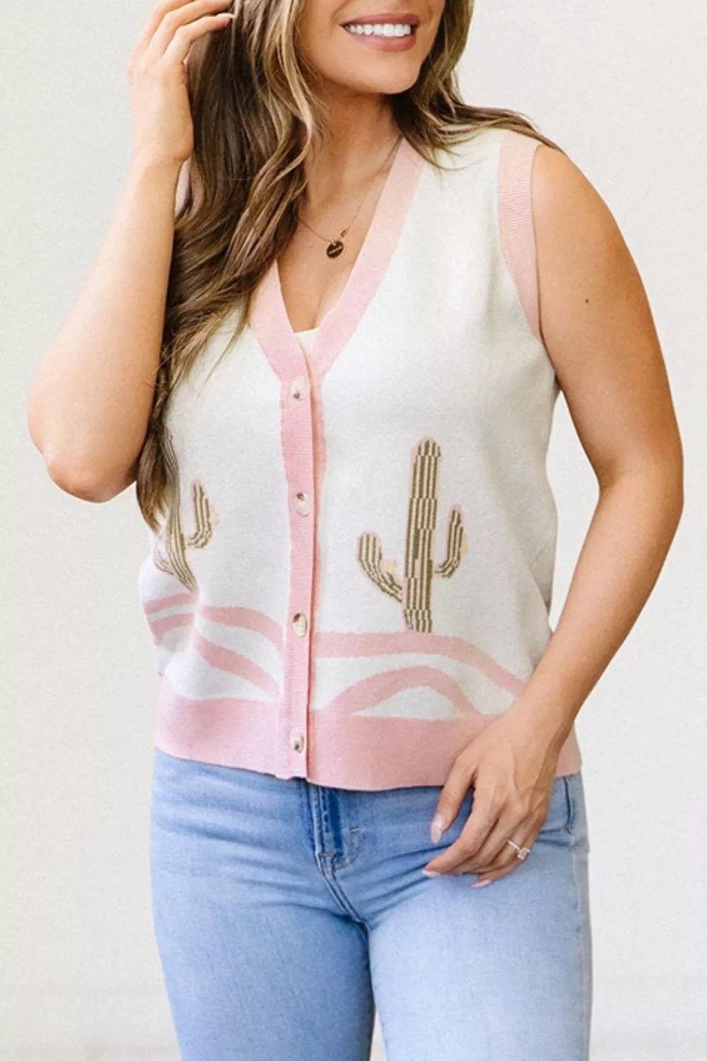 Sleeveless button-front knit vest with cactus designs, pink trim, soft stretch fabric, and desert-inspired boho style.