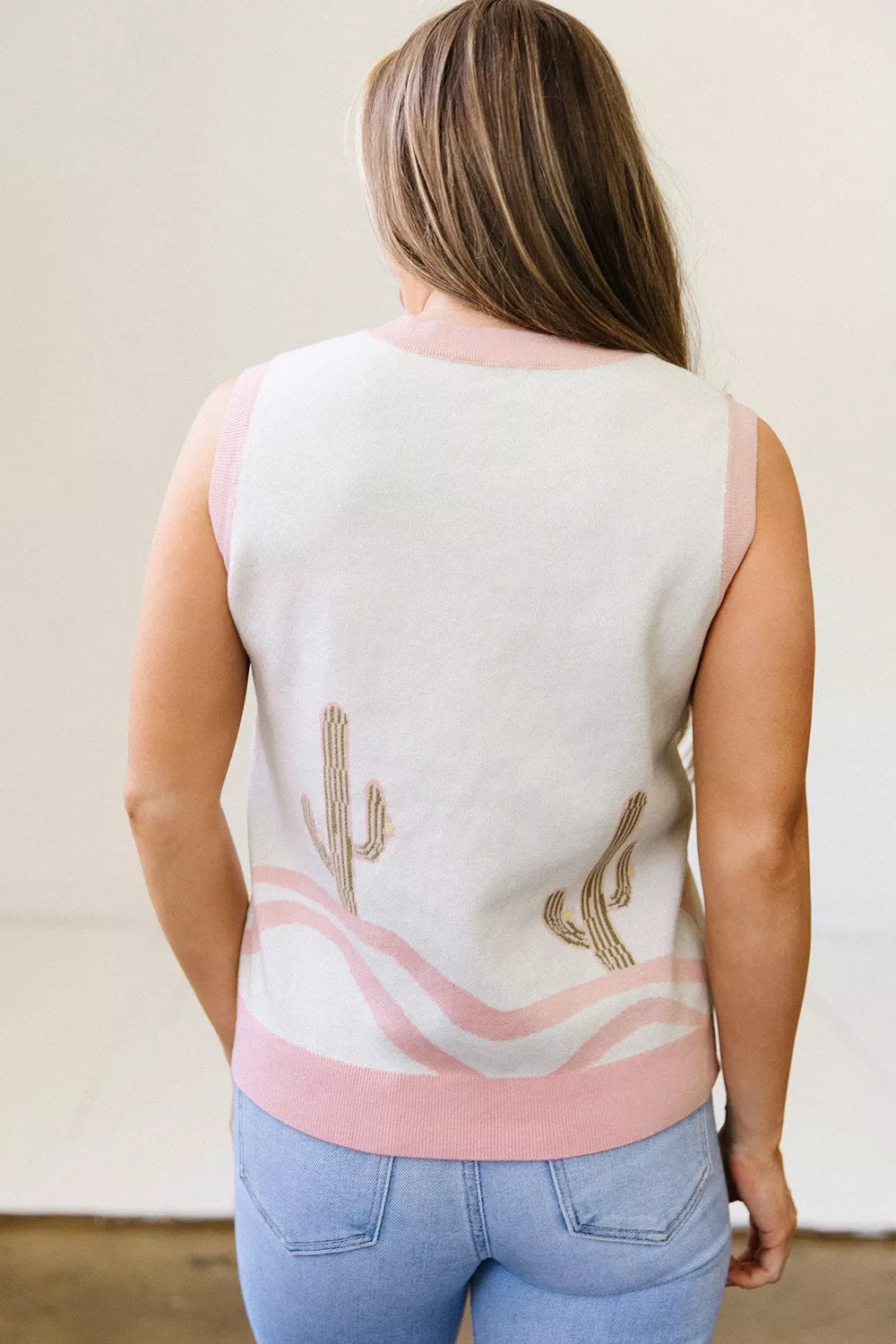 Sleeveless button-front knit vest with cactus designs, pink trim, soft stretch fabric, and desert-inspired boho style.