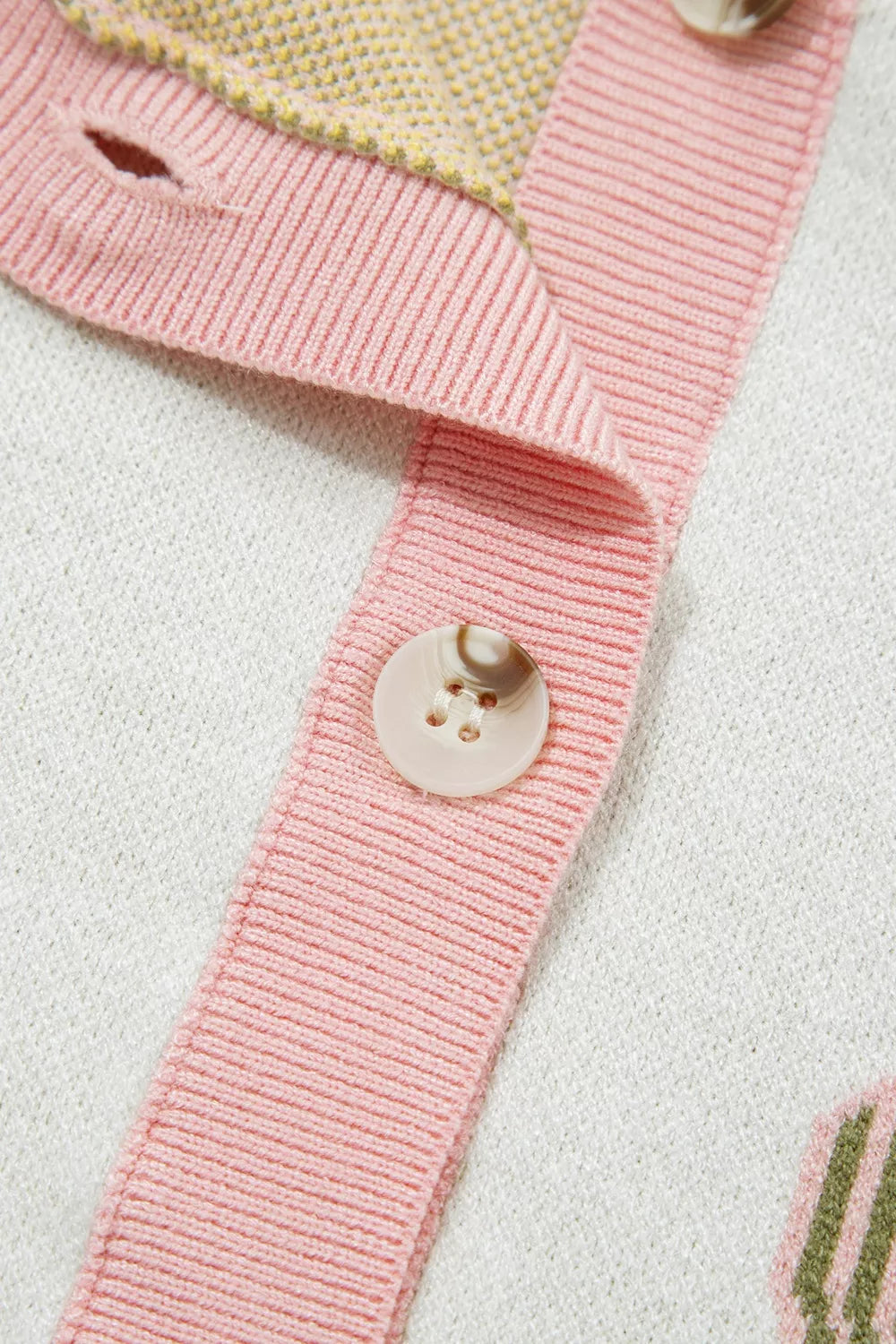 Sleeveless button-front knit vest with cactus designs, pink trim, soft stretch fabric, and desert-inspired boho style.