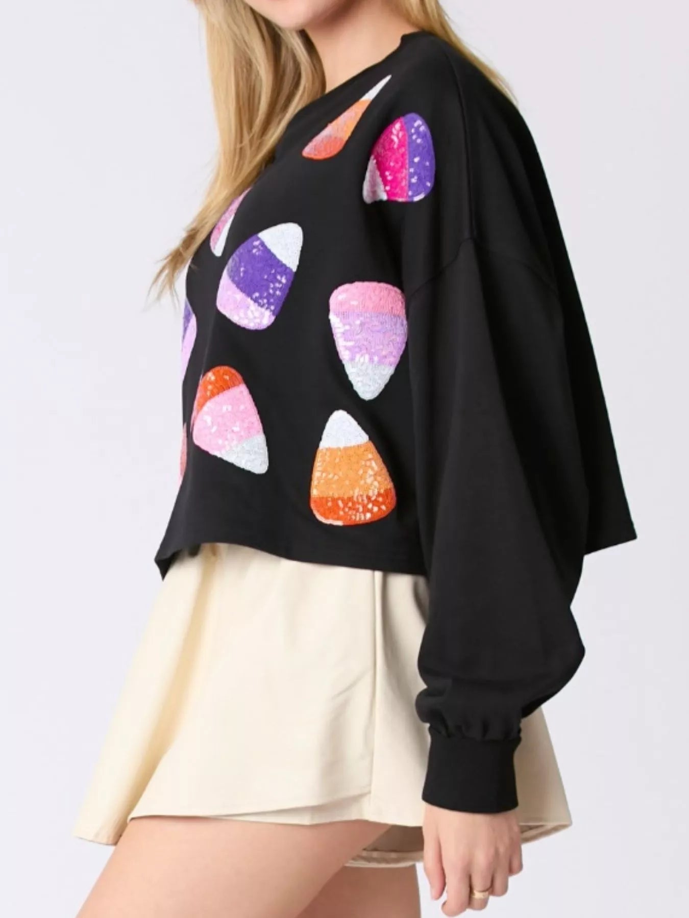 Black Candy Corn Sparkle Sweatshirt with sequin candy corn accents, cozy Halloween top.