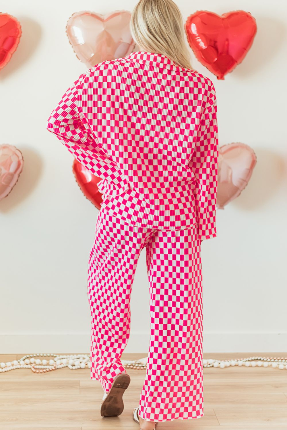 Pink and white checkered two piece lounge set with button down top and wide leg pants