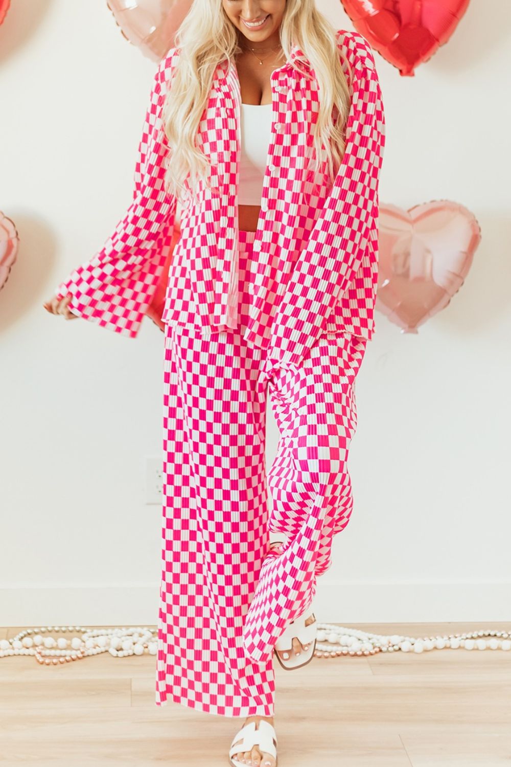 Pink and white checkered two piece lounge set with button down top and wide leg pants