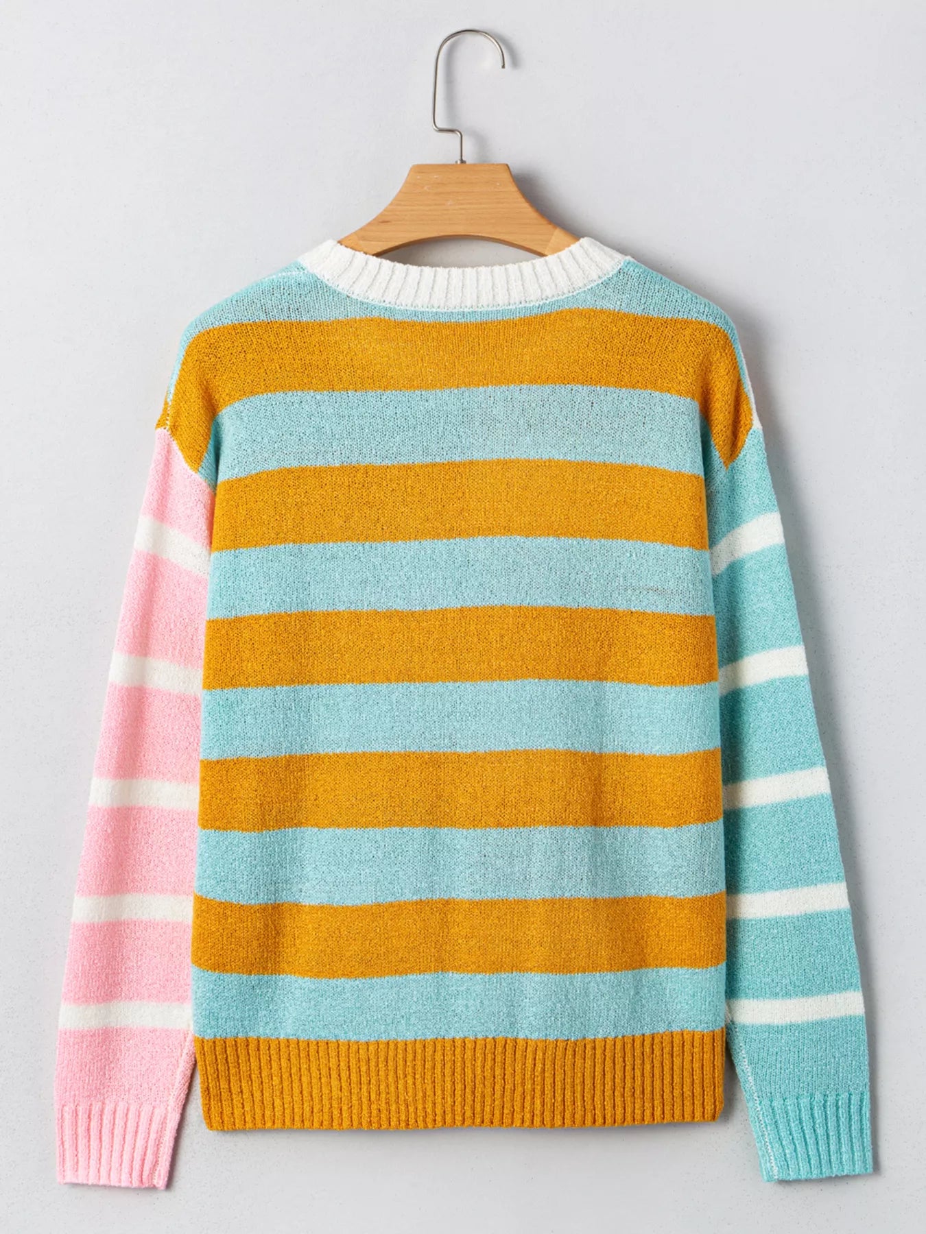 Candy Stripe Sweater – playful color block knit with pink, teal, white, and yellow stripes.