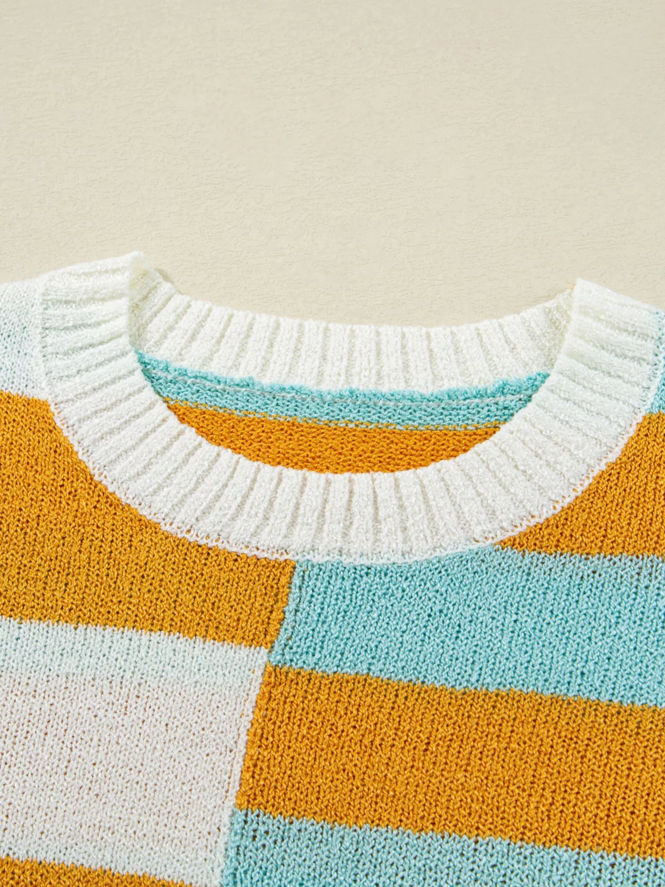 Candy Stripe Sweater – playful color block knit with pink, teal, white, and yellow stripes.
