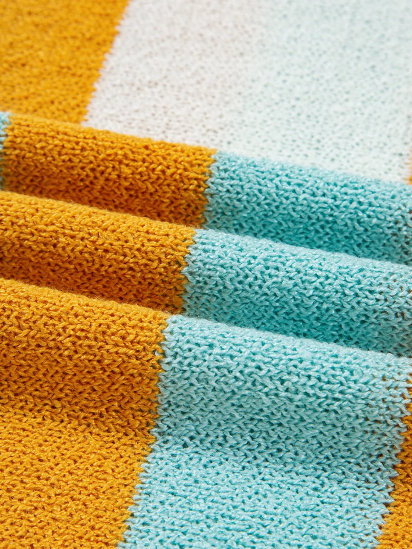 Candy Stripe Sweater – playful color block knit with pink, teal, white, and yellow stripes.