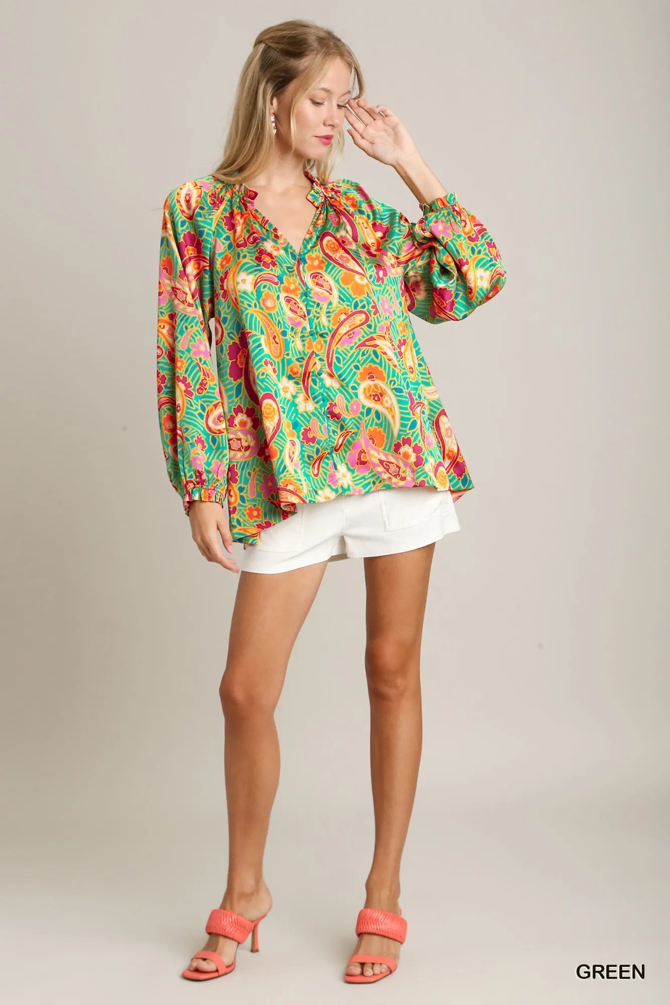 Green satin blouse with multicolor paisley print, ruffle neck, and button-up front – Carnival Paisley Satin Blouse from A Whimsical Affair.