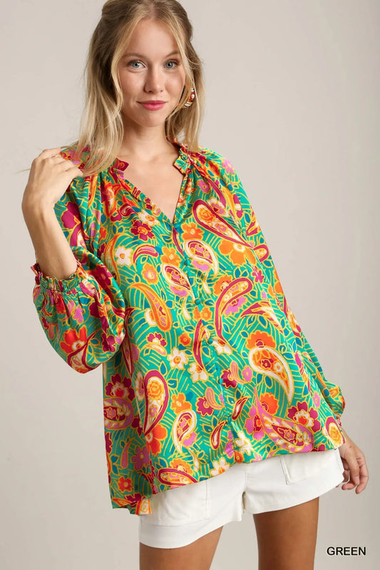 Green satin blouse with multicolor paisley print, ruffle neck, and button-up front – Carnival Paisley Satin Blouse from A Whimsical Affair.