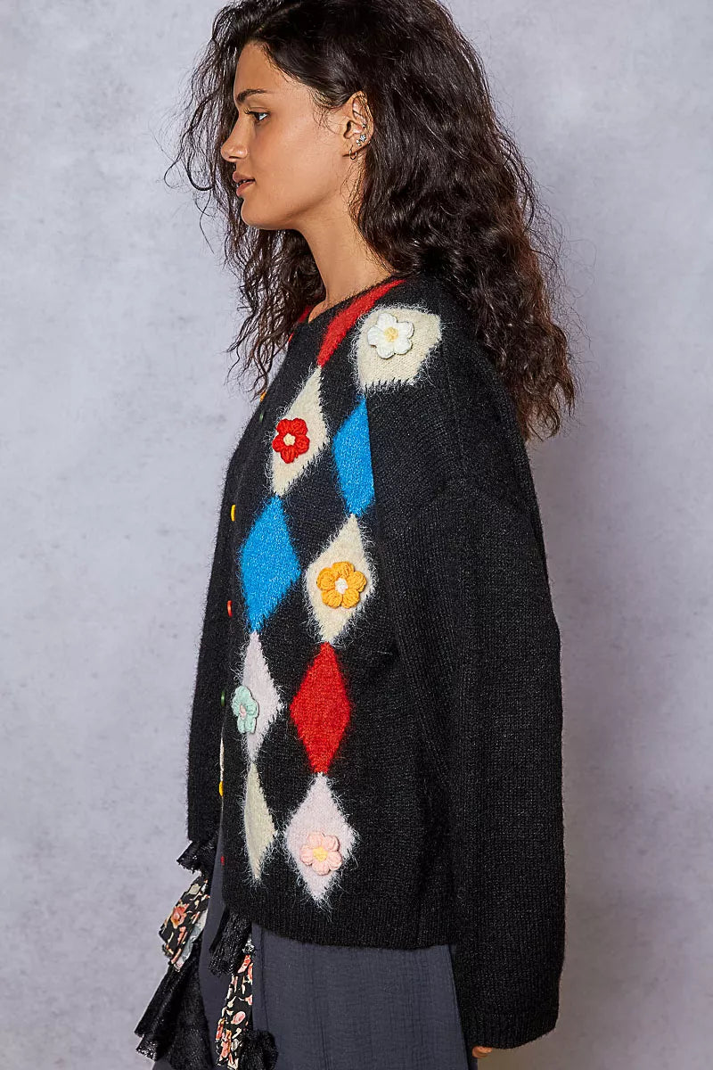 Side angle showing sleeve flowers and textured knit