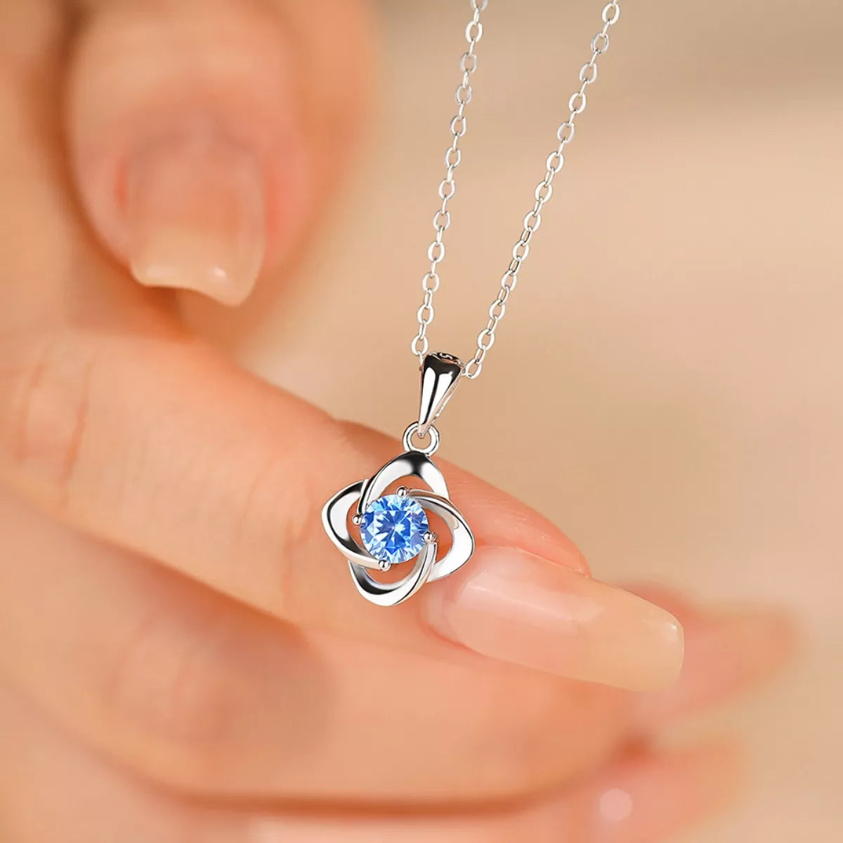 sterling silver celestial orbit pendant necklace with blue zircon stone