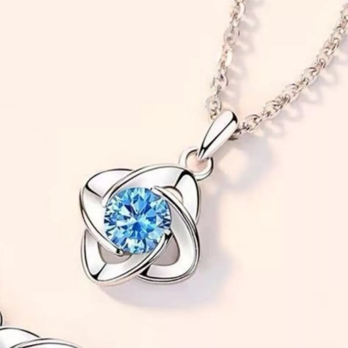 sterling silver celestial orbit pendant necklace with blue zircon stone