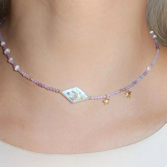 Celestial Harmony Pearl Necklace – freshwater pearl and purple beaded necklace with gold-plated star and moon charms.