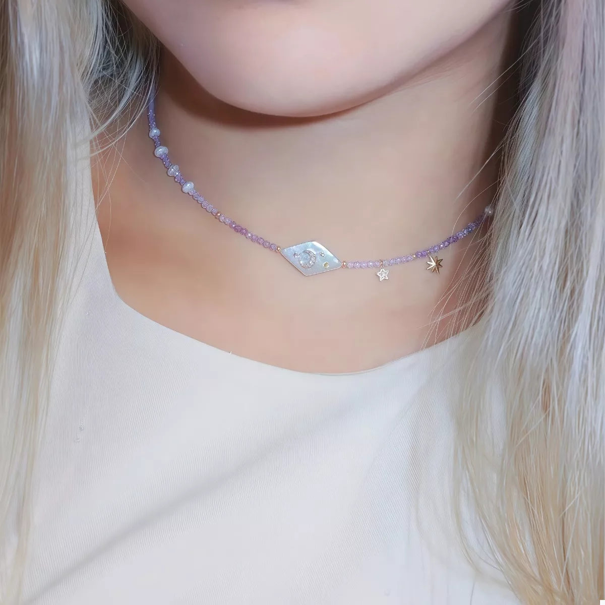 Celestial Harmony Pearl Necklace – freshwater pearl and purple beaded necklace with gold-plated star and moon charms.