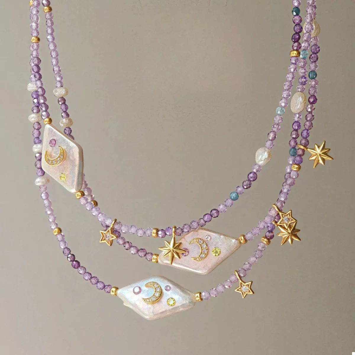 Celestial Harmony Pearl Necklace – freshwater pearl and purple beaded necklace with gold-plated star and moon charms.