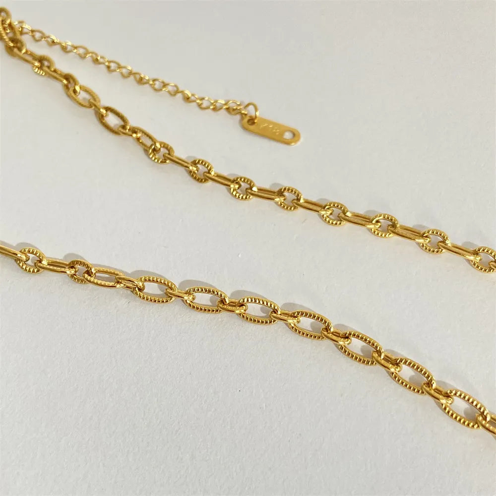 Sun and moon pendant necklace in 18K gold-plated titanium steel with white mother-of-pearl – Celestial Harmony style from A Whimsical Affair.