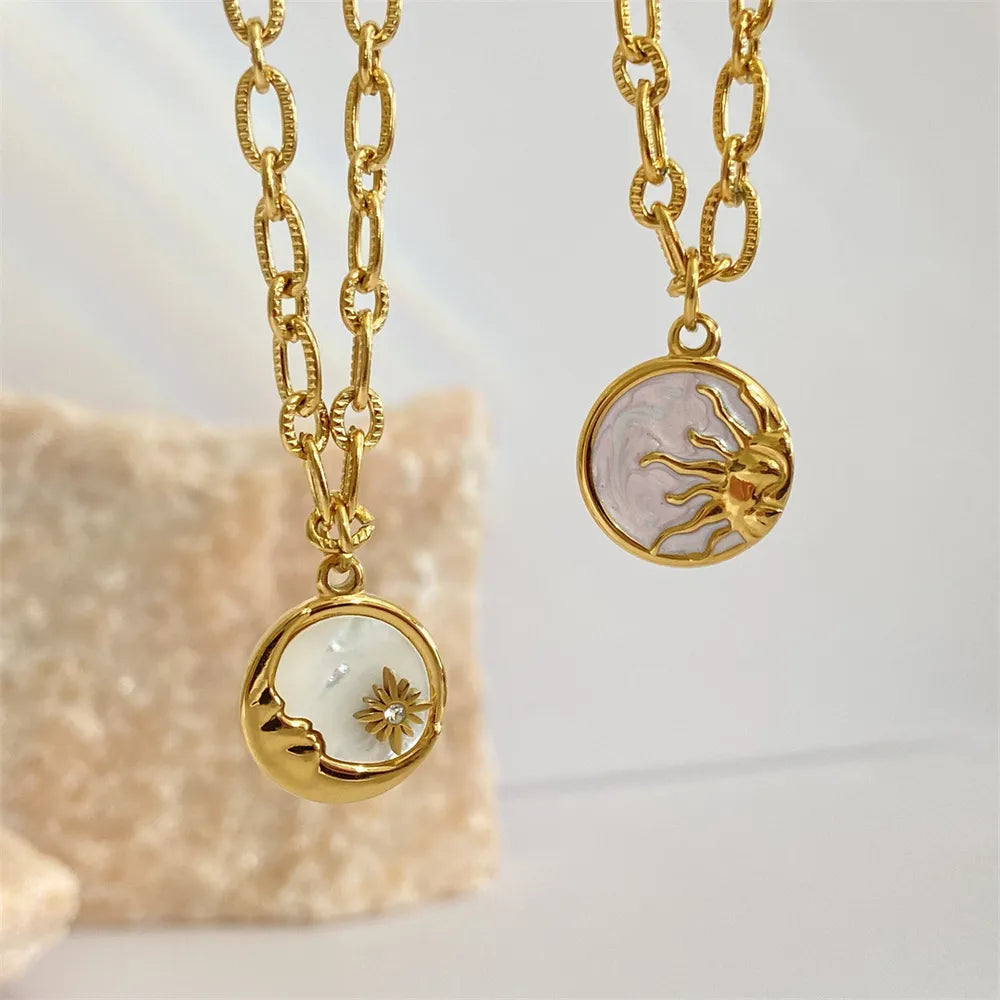 Sun and moon pendant necklace in 18K gold-plated titanium steel with white mother-of-pearl – Celestial Harmony style from A Whimsical Affair.