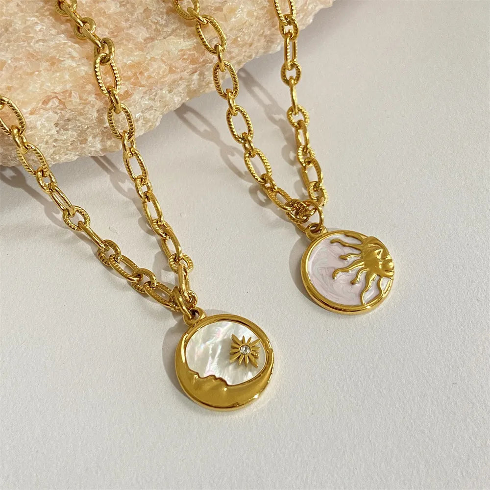 Sun and moon pendant necklace in 18K gold-plated titanium steel with white mother-of-pearl – Celestial Harmony style from A Whimsical Affair.