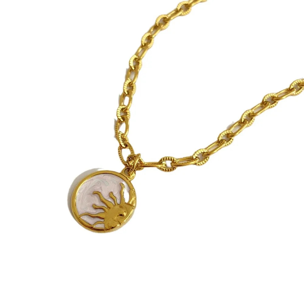 Sun and moon pendant necklace in 18K gold-plated titanium steel with white mother-of-pearl – Celestial Harmony style from A Whimsical Affair.