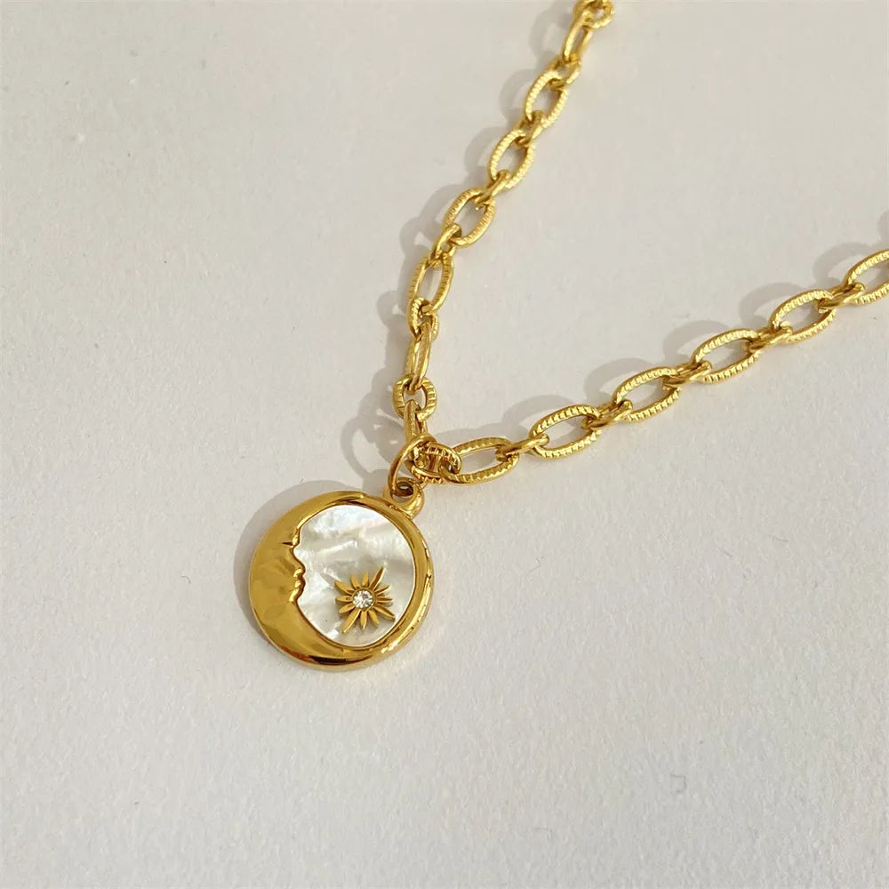 Sun and moon pendant necklace in 18K gold-plated titanium steel with white mother-of-pearl – Celestial Harmony style from A Whimsical Affair.