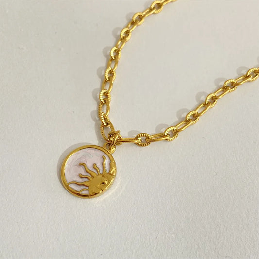 Sun and moon pendant necklace in 18K gold-plated titanium steel with white mother-of-pearl – Celestial Harmony style from A Whimsical Affair.