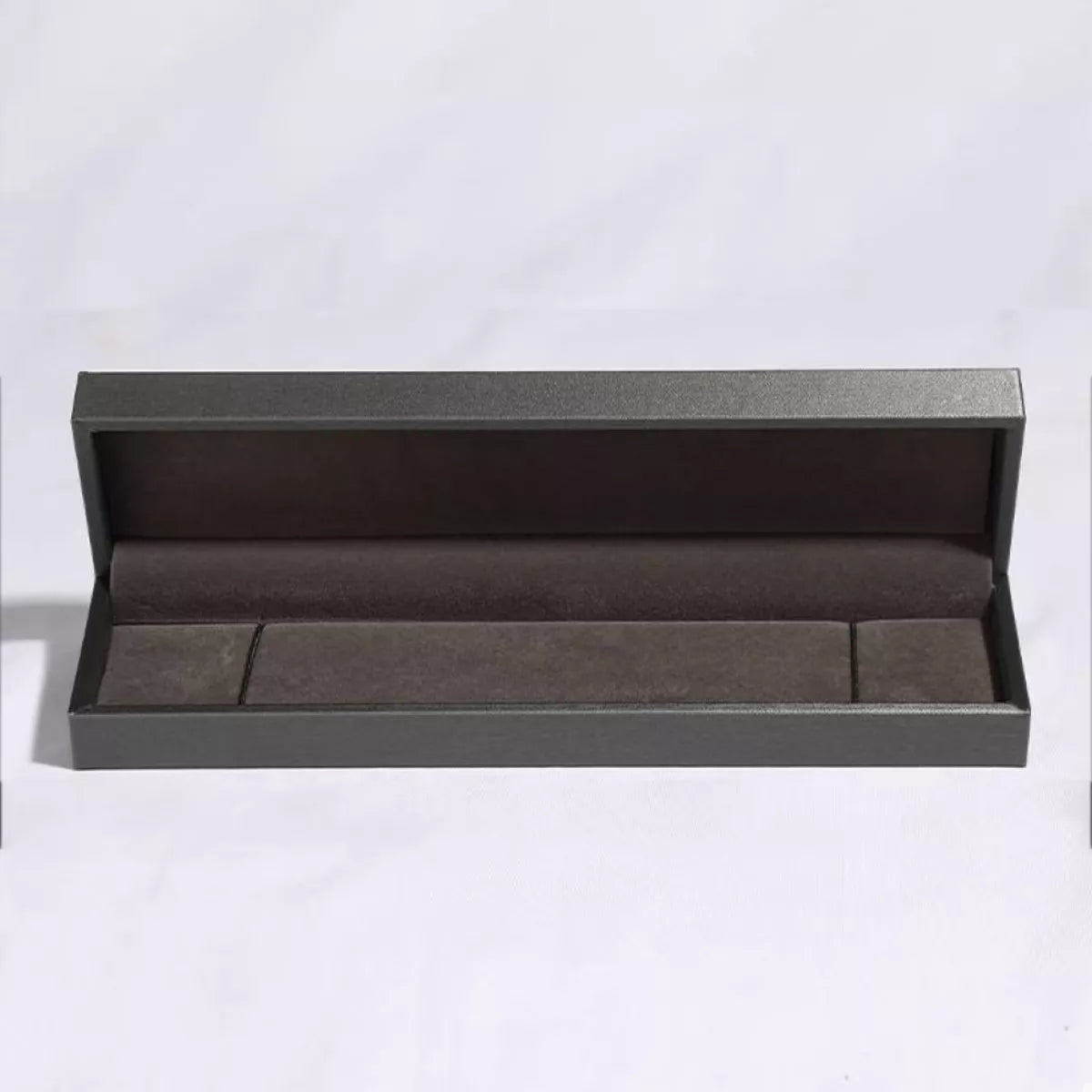 Box for platinum-plated sterling silver bracelet with celestial star details and a luminous glass stone centerpiece