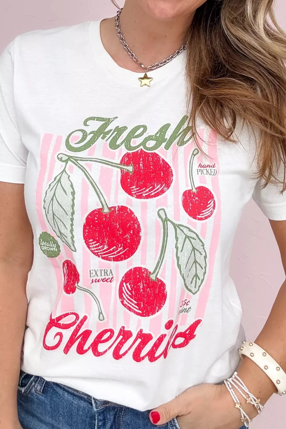 oversized white graphic tee with retro cherry print and pink striped design for a playful summer aesthetic