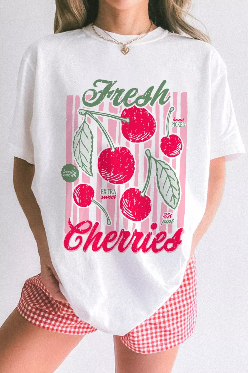 oversized white graphic tee with retro cherry print and pink striped design for a playful summer aesthetic