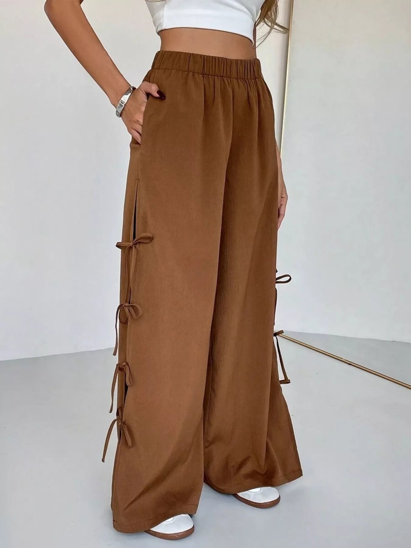 Brown wide leg pants with side tie bow details