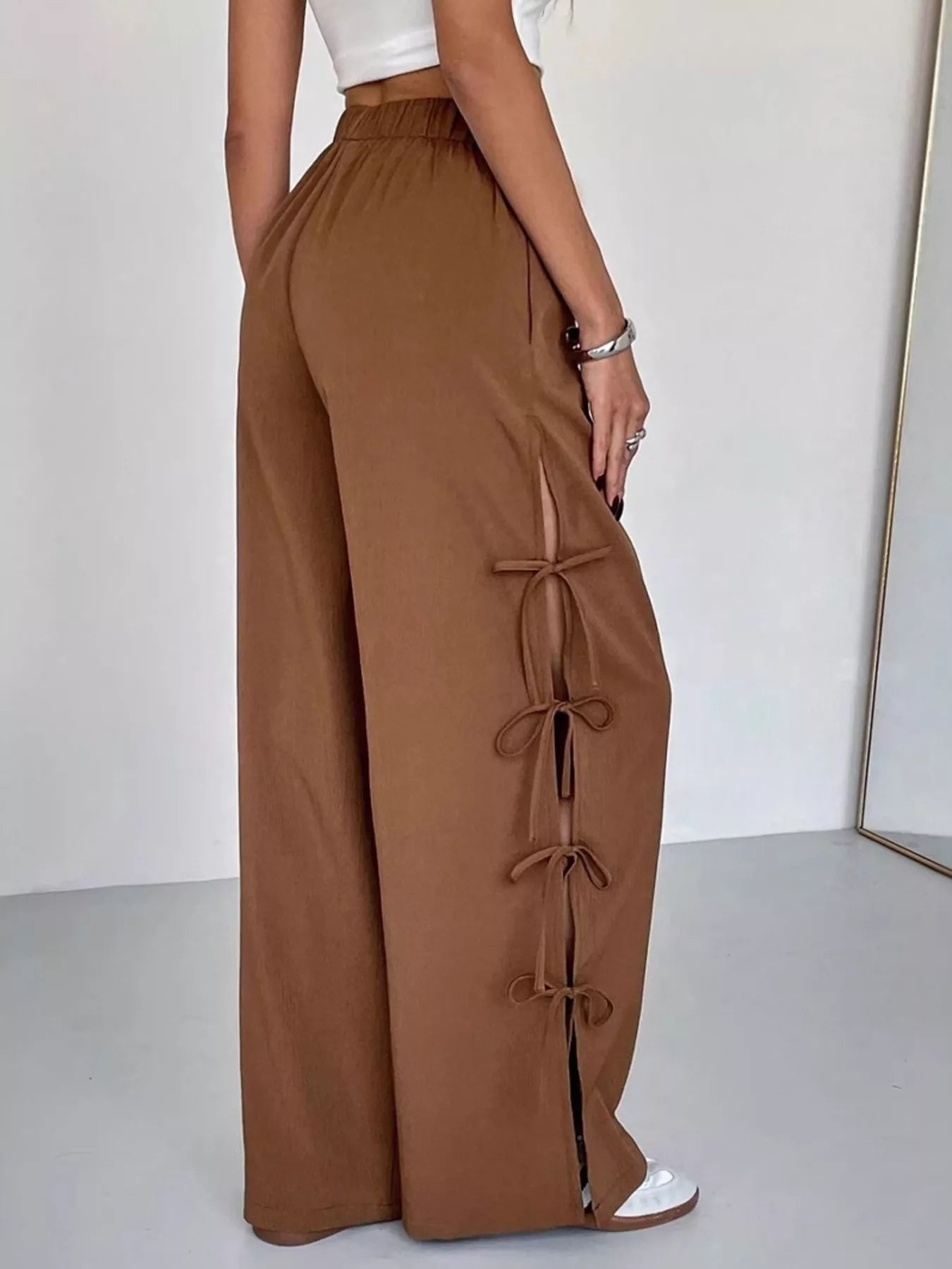 Brown wide leg pants with side tie bow details