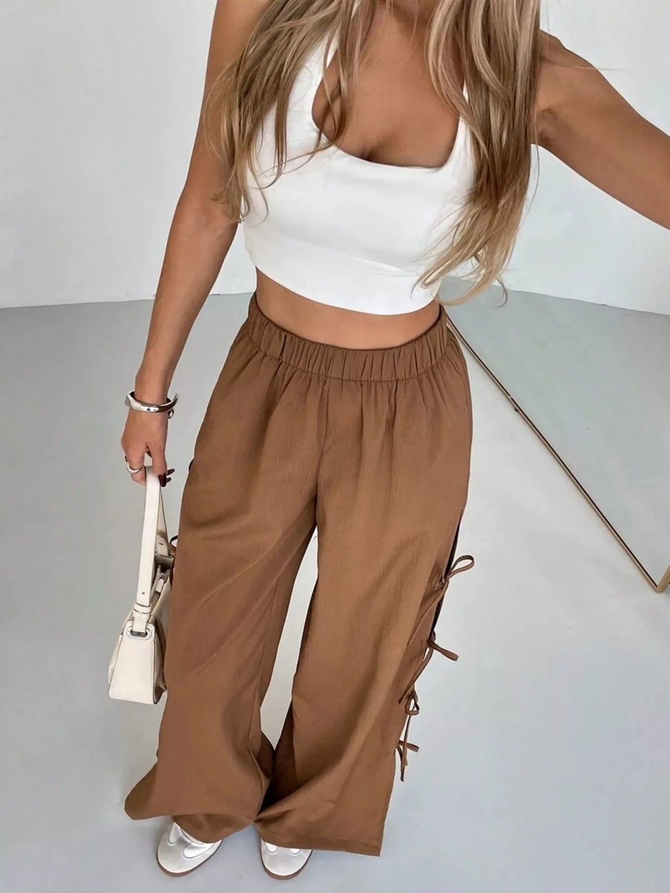 Brown wide leg pants with side tie bow details