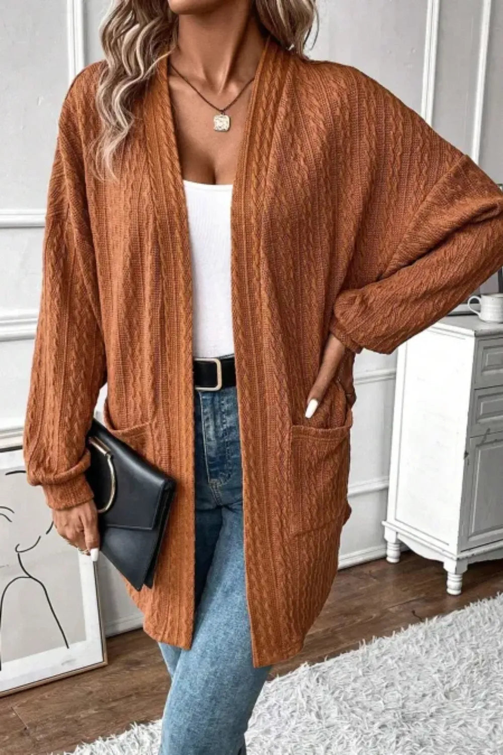rust textured knit cardigan with open front and front pockets