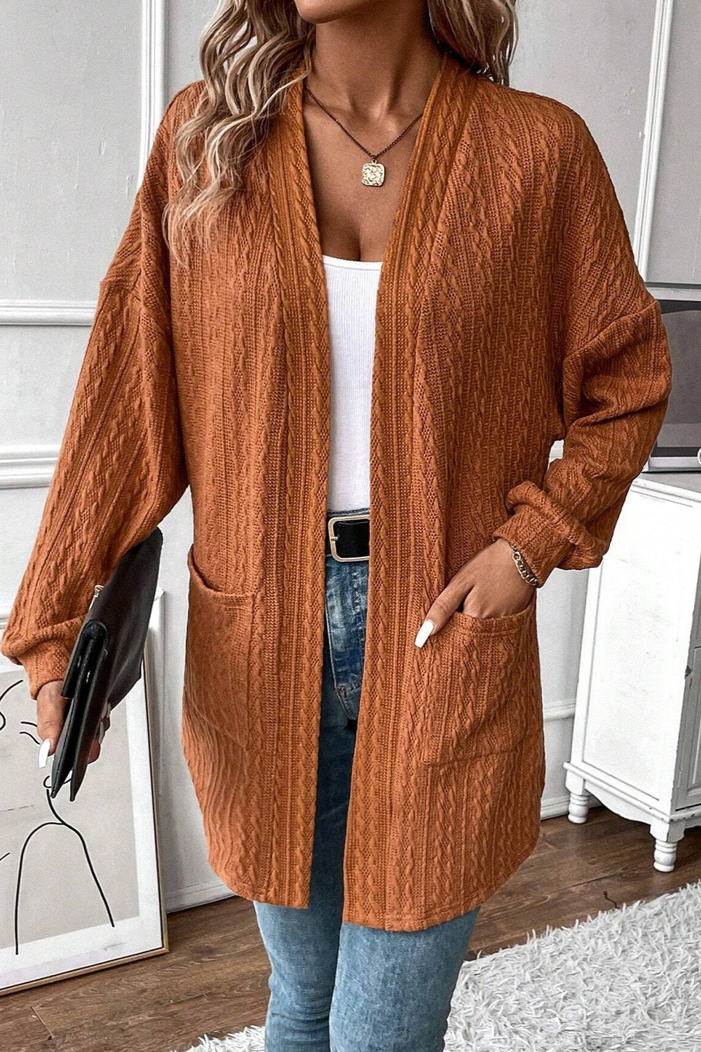 rust textured knit cardigan with open front and front pockets