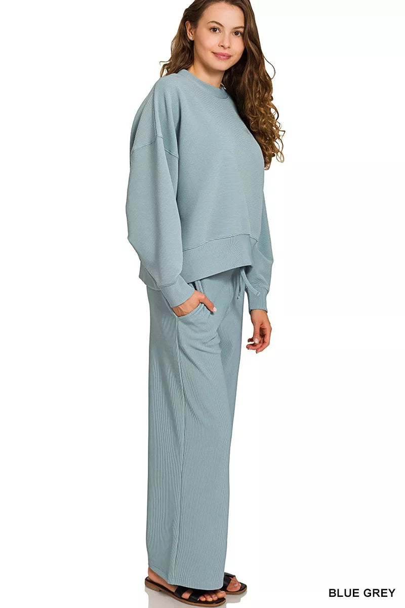 Cloud Nine Ribbed Lounge Set – blue-grey ribbed pullover with matching drawstring pants, cozy two-piece outfit.