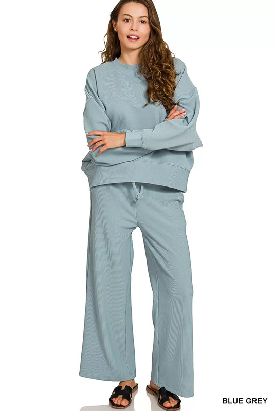 Cloud Nine Ribbed Lounge Set – blue-grey ribbed pullover with matching drawstring pants, cozy two-piece outfit.