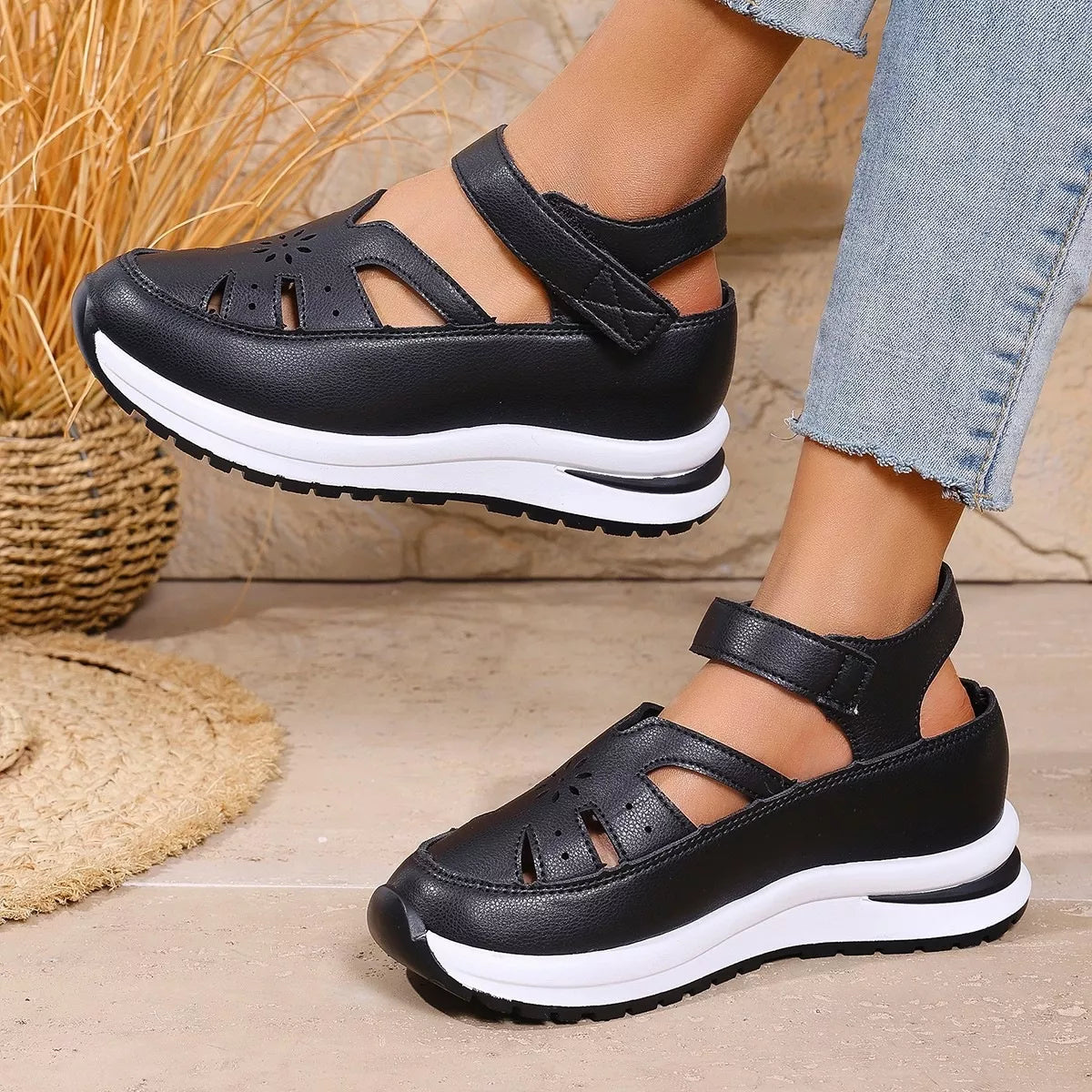 Black cutout Mary Jane shoes with adjustable ankle strap, low heel, PU leather material, rubber sole, and casual everyday styling.