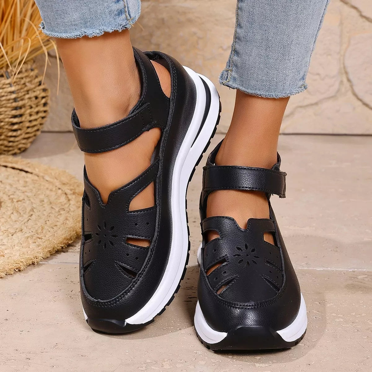 Black cutout Mary Jane shoes with adjustable ankle strap, low heel, PU leather material, rubber sole, and casual everyday styling.
