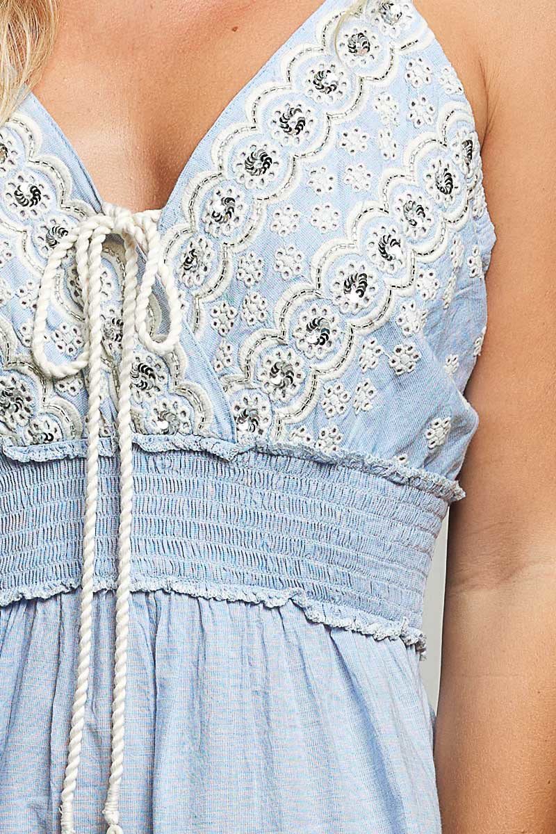 light blue cotton eyelet mini dress with smocked waist and tassel tie front