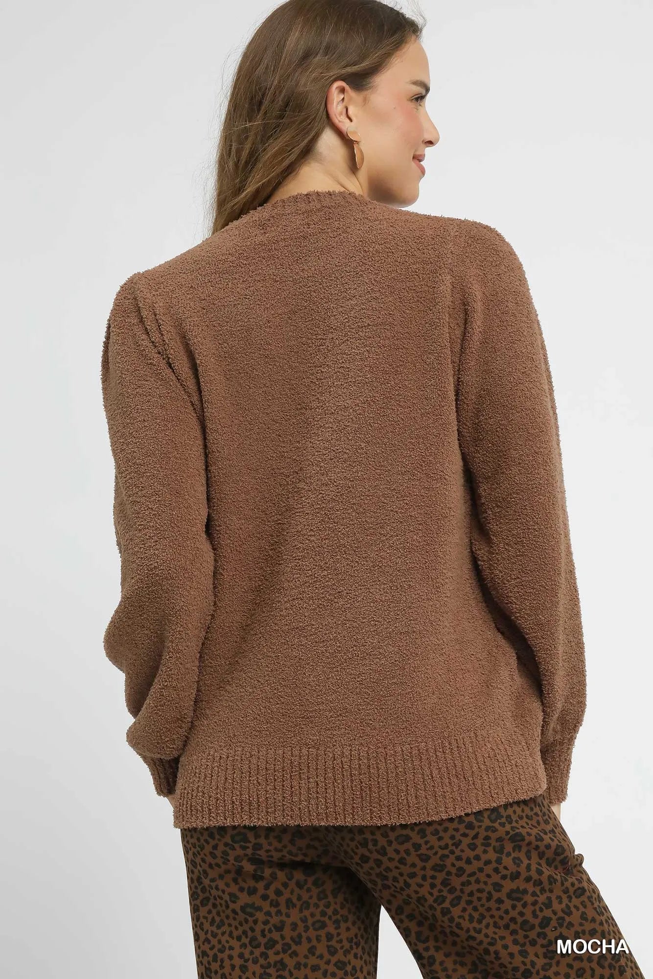 Oversized mocha brown textured sweater with ribbed trim and long sleeves, styled with leopard print pants.