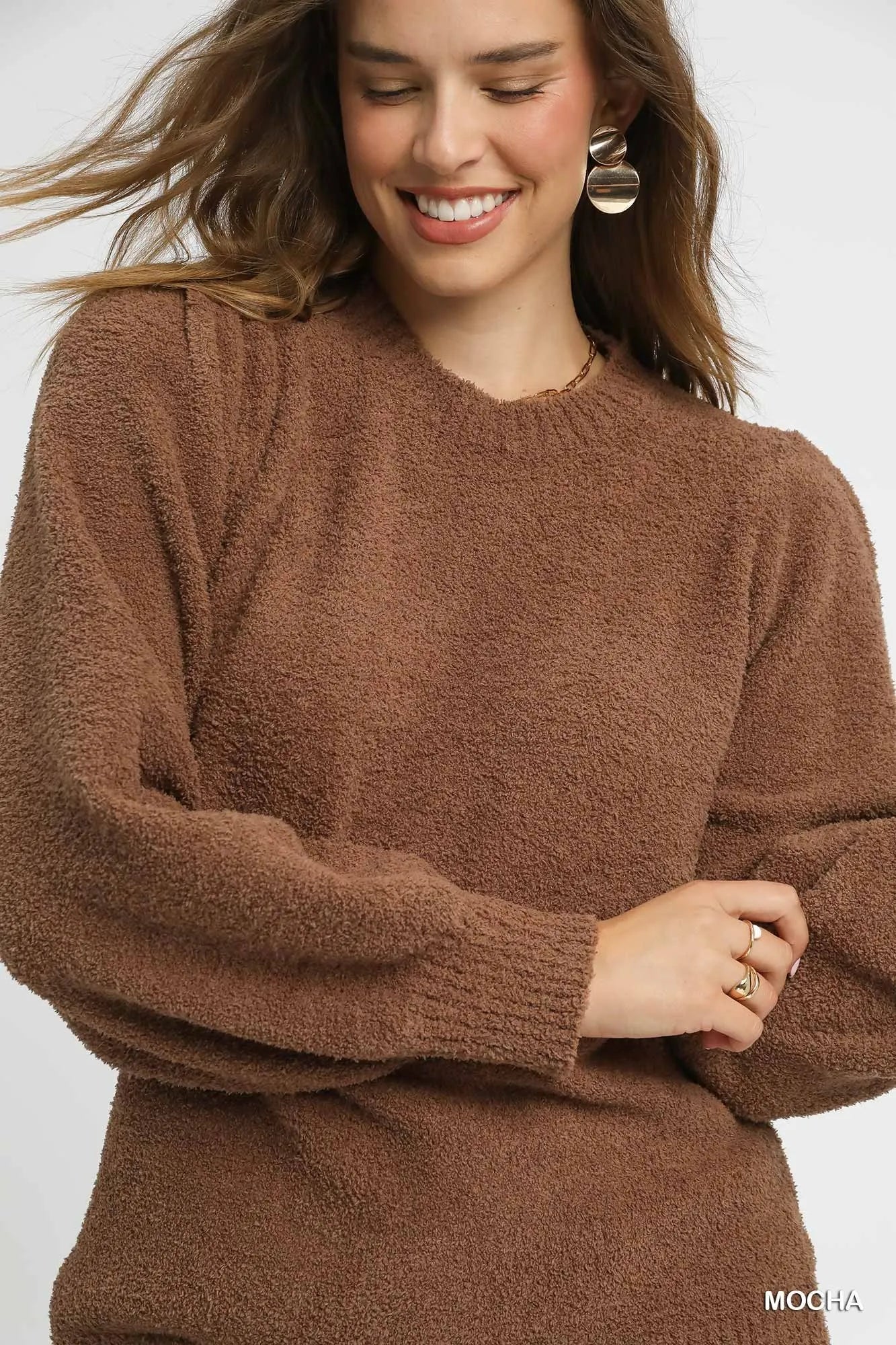 Oversized mocha brown textured sweater with ribbed trim and long sleeves, styled with leopard print pants.