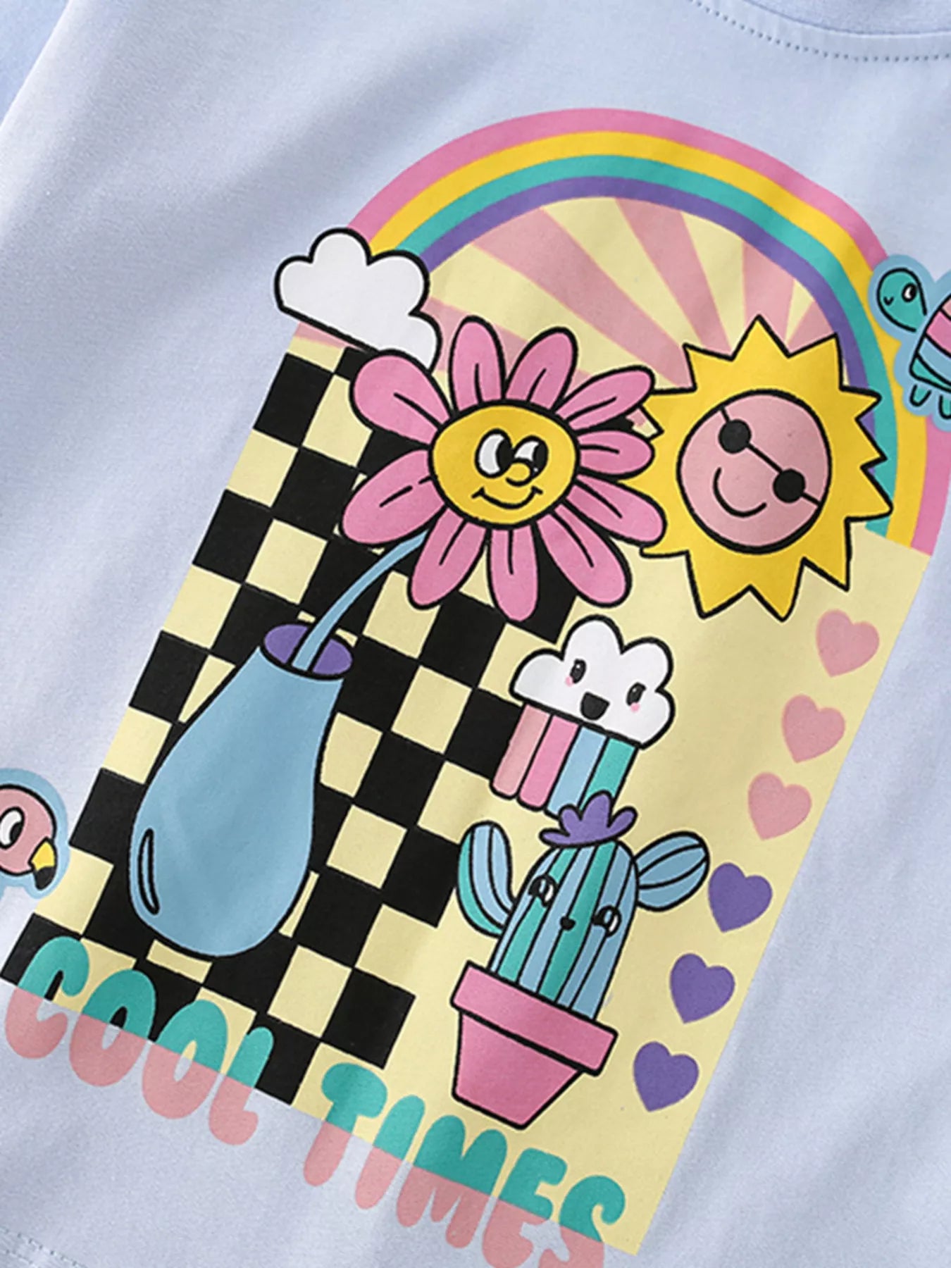 Kids light blue graphic tee with rainbow retro print