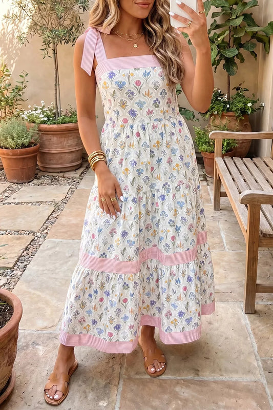 Floral tiered midi dress with pink tie-shoulder detail, contrast trim, flowy skirt, and breezy garden-inspired style.