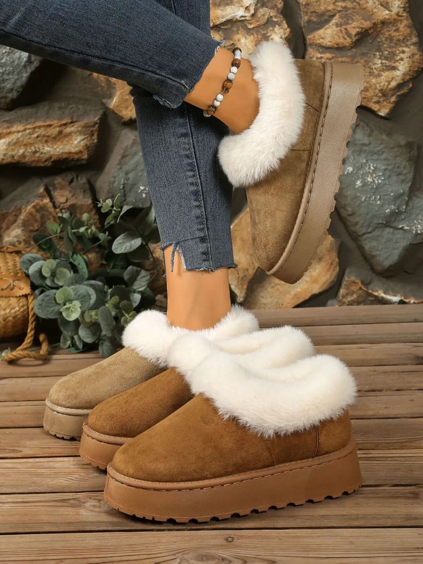 Woman wearing tan faux fur-lined winter slippers with platform soles — cozy cold-weather footwear from A Whimsical Affair.