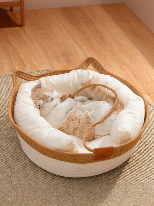 Cat resting inside cat ear shaped cotton pet bed with optional cushion padding