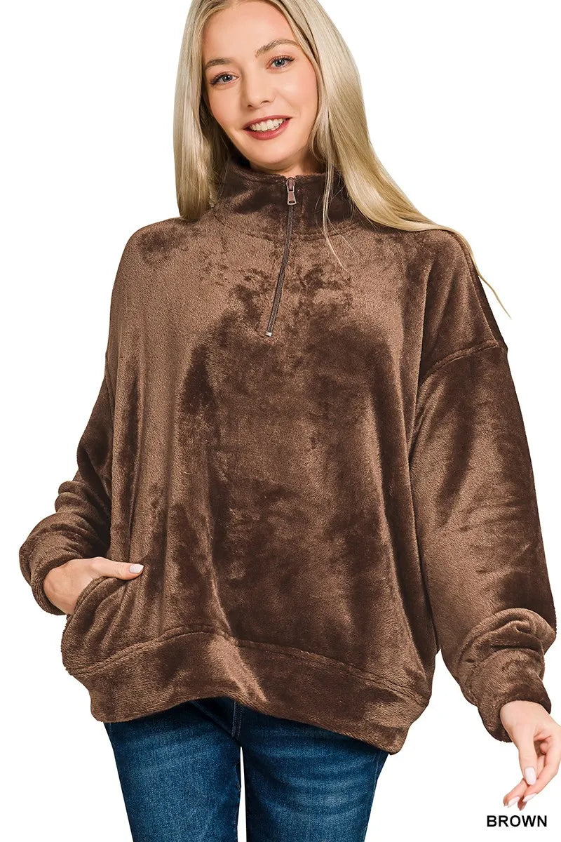 Model wearing brown Zenana Cozy Luxe faux fur half zip pullover with pockets.